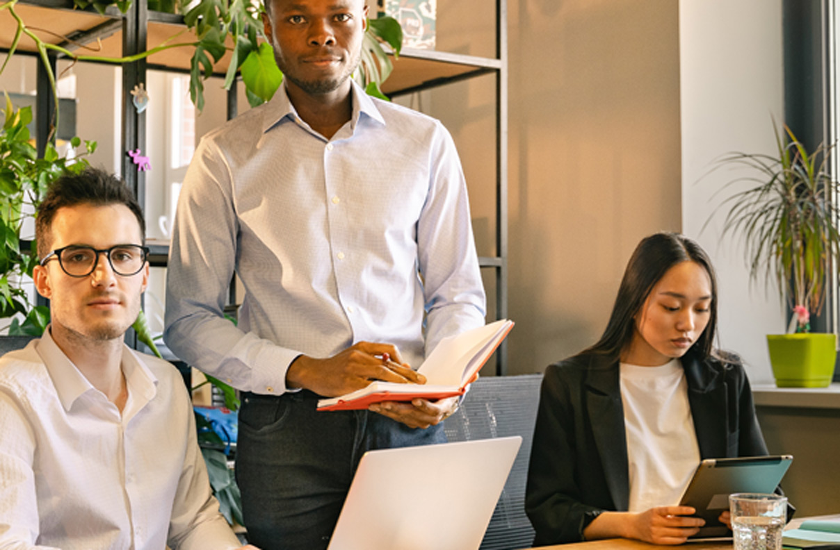 Three people working in an office