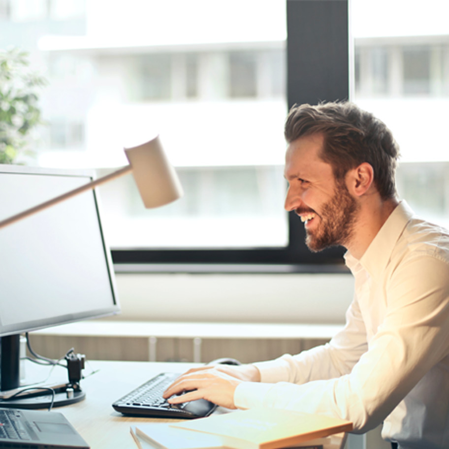 A person at their computer typing