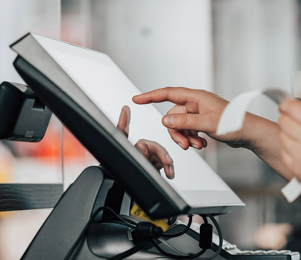 Someone using a cash register