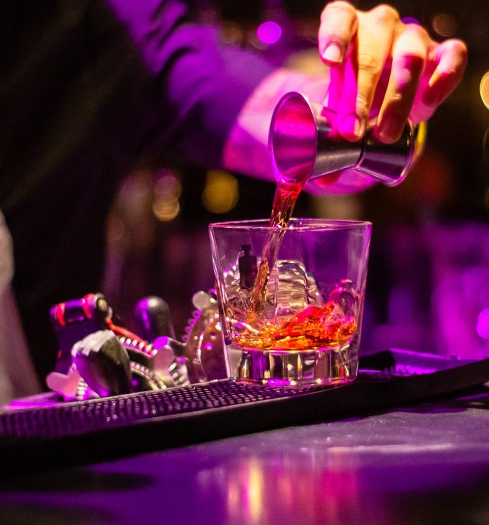 A bartender making a drink