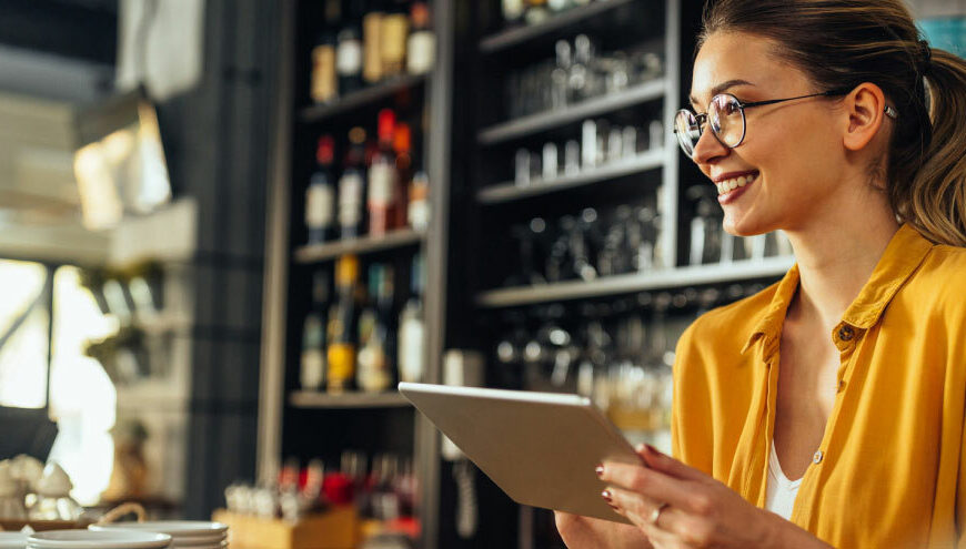 Restaurant manager utilizing a centralized payroll platform.